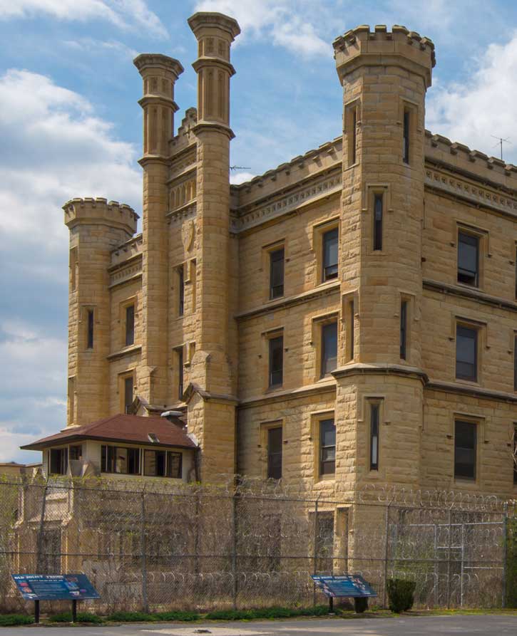 Interpretive signs outside the multi-story Joliet Prison on route 66 in illinois