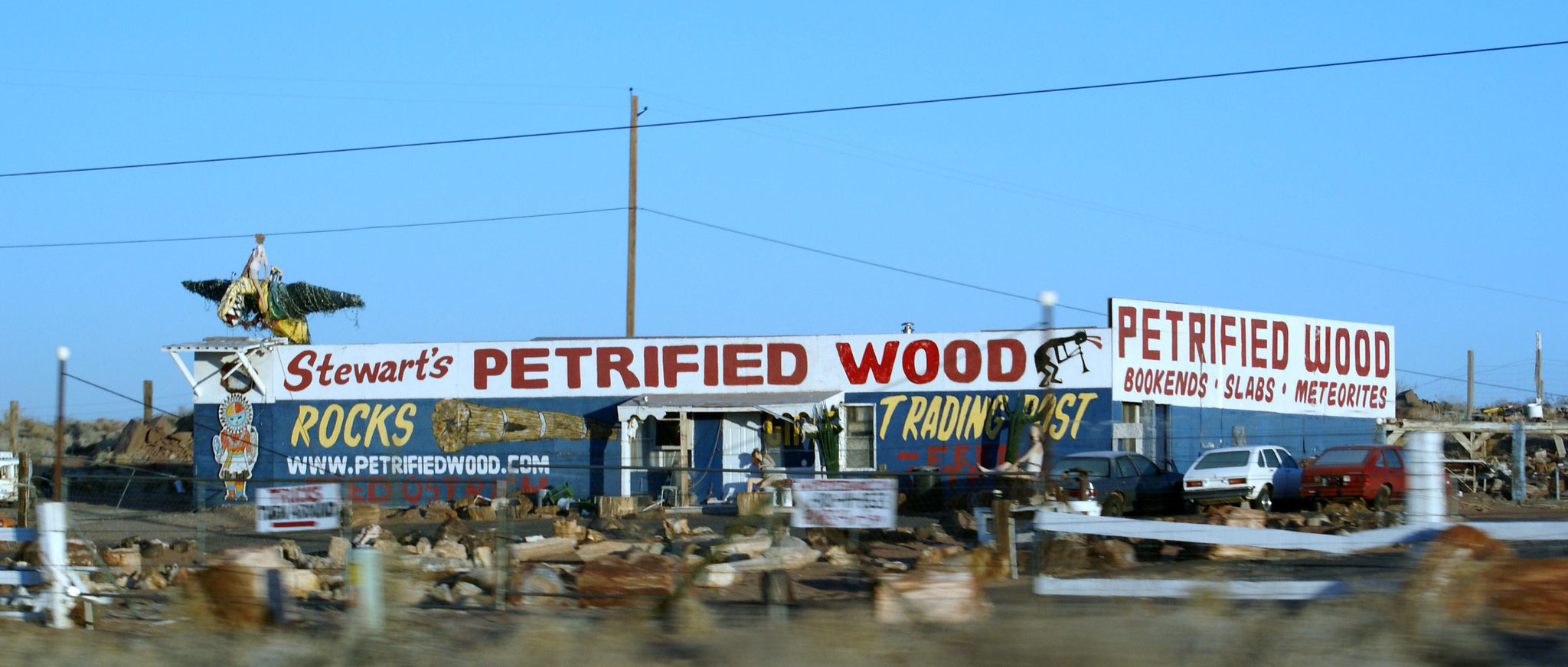 Touristy roadside building with Stewarts Petrified Wood painted on it